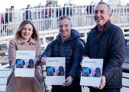 Members of Ana Liffey holding Emer Dolphin's evaluation of the Law Engagement & Assisted Recovery project